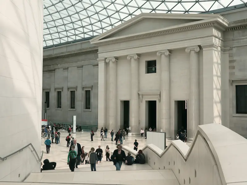 The Great Court of the British Museum featuring its iconic glass roof and neoclassical architecture.