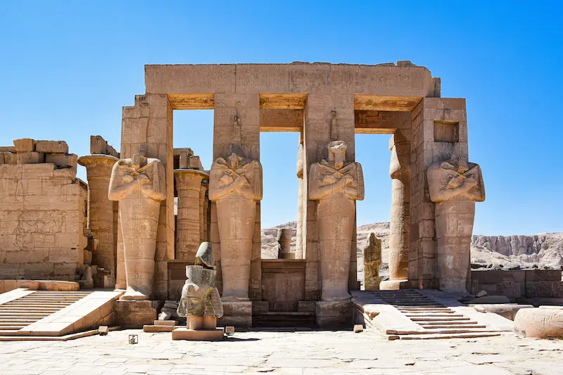 Ancient Egyptian temple with colossal statues and pillars, Luxor, Egypt