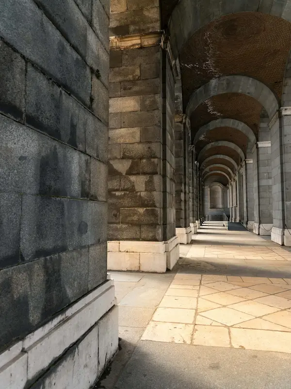 a long hallway in royal palace of madrid