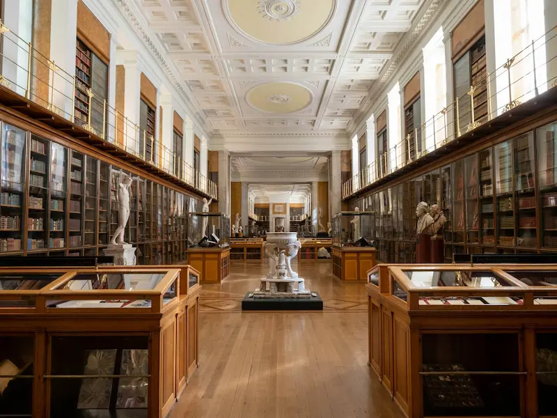 interior of the British Museum with wooden bookshelves
