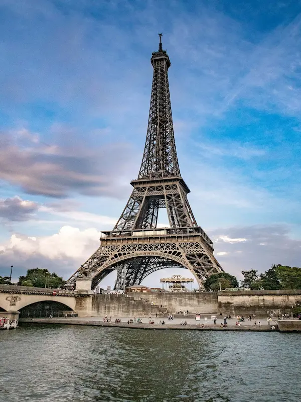 Eiffel Tower in Paris with the Seine River in the foreground