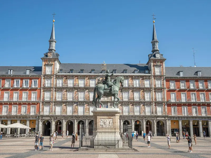 statue of man on a horse in front of plaza mayor spain