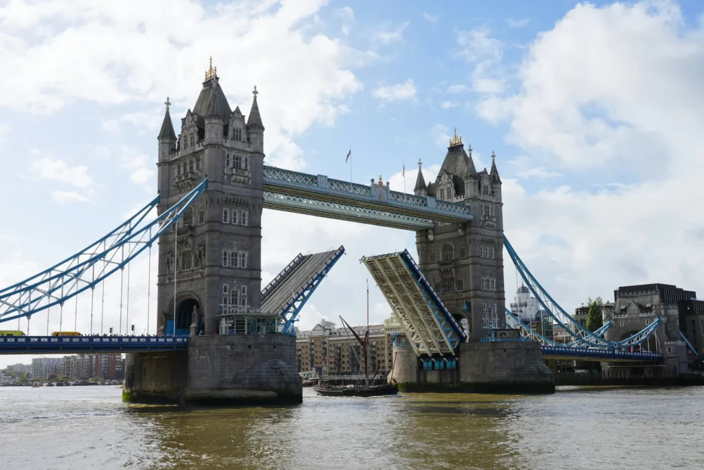 Tower Bridge with its bascules raised to allow a ship to pass